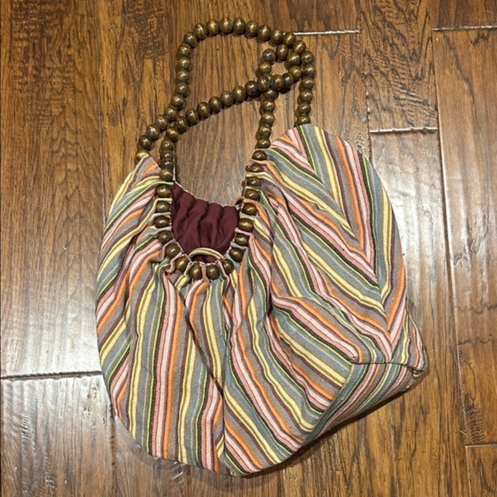 Amici hobo bag with stripe pattern and wooden beaded strap.